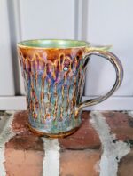 Handthrown, carved, and glazed mug.